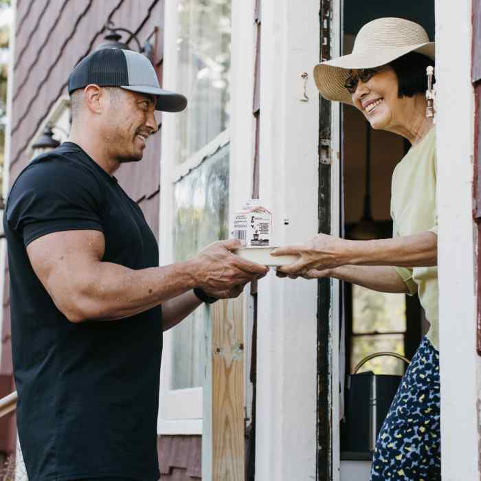 Person delivering Meals on Wheels to a recipient