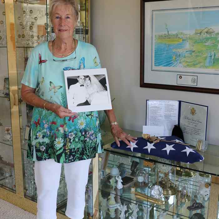 Wilder donor Renee Nagel stands with a photo of her late husband John in the family home