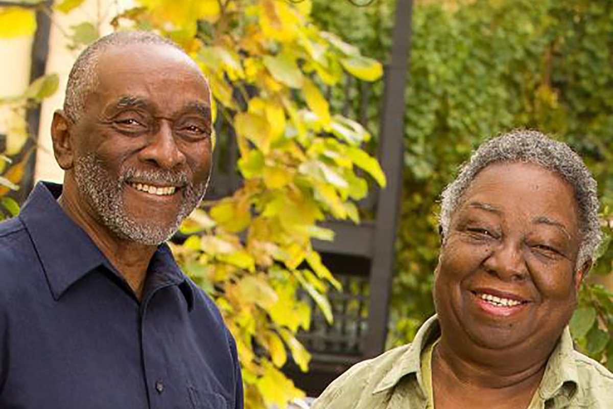 Older man and woman in backyard setting
