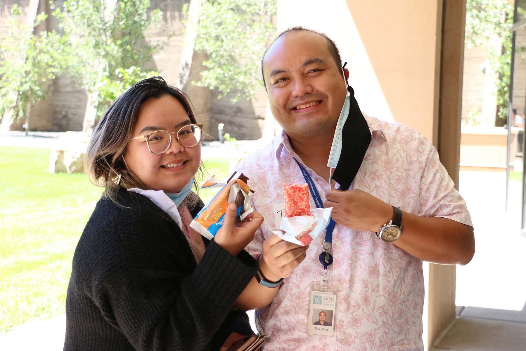 A woman and man pose together at the Wilder staff picnic in July 2022