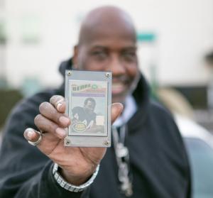 Mr. Allen holding Walter Payton football card