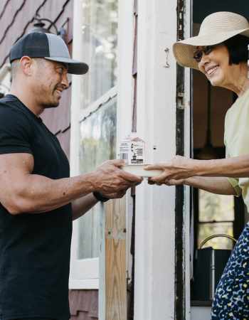 Person delivering Meals on Wheels to a recipient